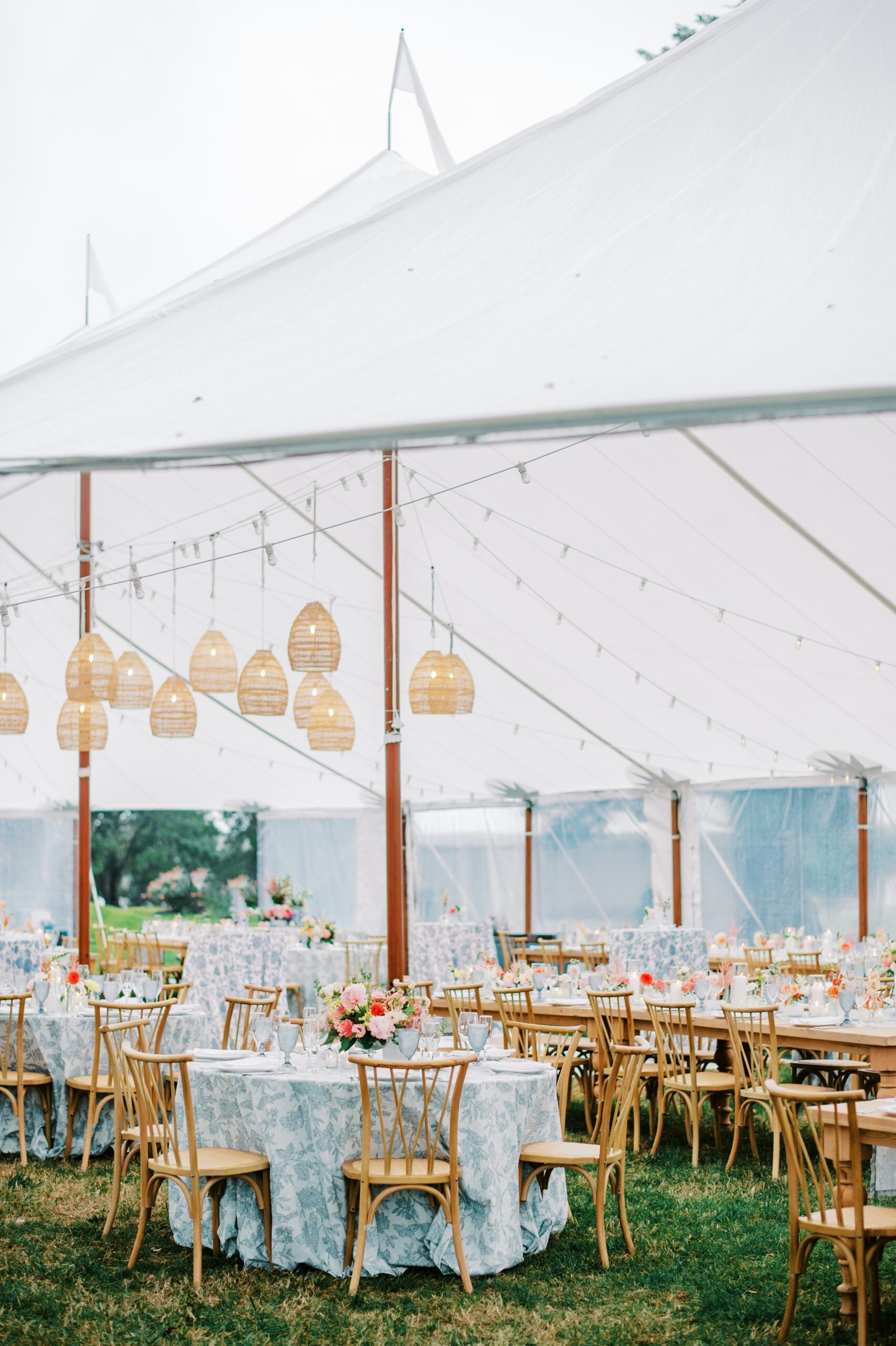 Sailcloth Tent with hanging lanterns and beige chairs for a Kirkland Manor Wedding